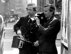 FILE - In this July 1969 file photo, documentary filmmakers David, left, and Albert Maysles work on the streets of New York for "Salesman." Albert Maysles, who along with his brother David made works of cinema verite in the 1960s and 70s, including the Rolling Stones documentary Gimme Shelter, died Thursday, March 5, 2015 in New York. He was 88. His brother David Maysles died in 1987. (AP Photo, File)